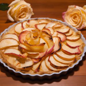 A golden-brown Apple Rose Tart with a sweet and crumbly crust and rose-shaped apples on top