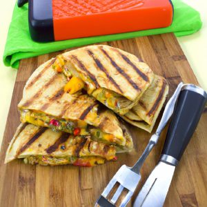 Grilled veggie quesadillas on a cutting board with a pair of tongs