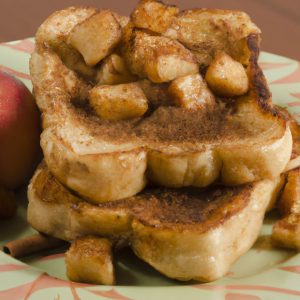 image of a plate full of freshly made French toast with apples and cinnamon